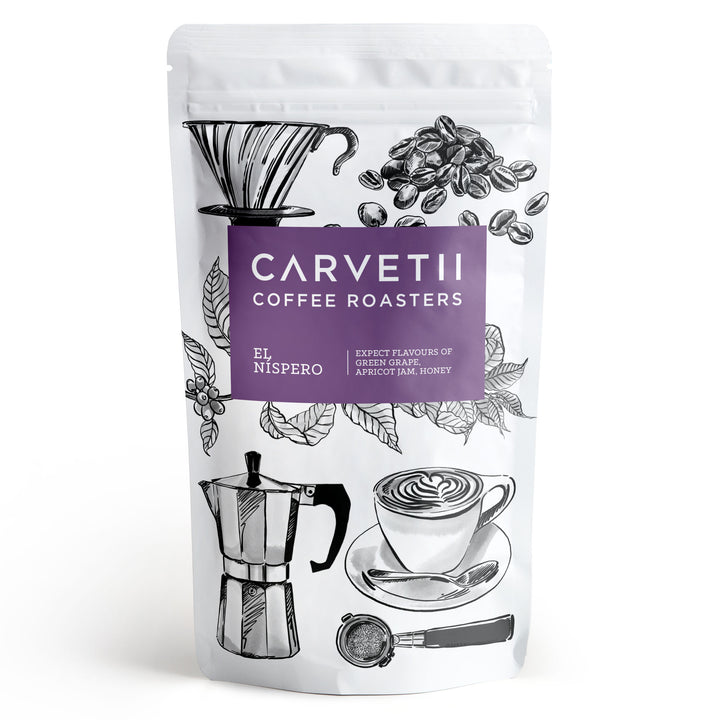 Carvetii Coffee Roasters El Nispero coffee in a white stand-up pouch with a purple label and black coffee-related illustrations.